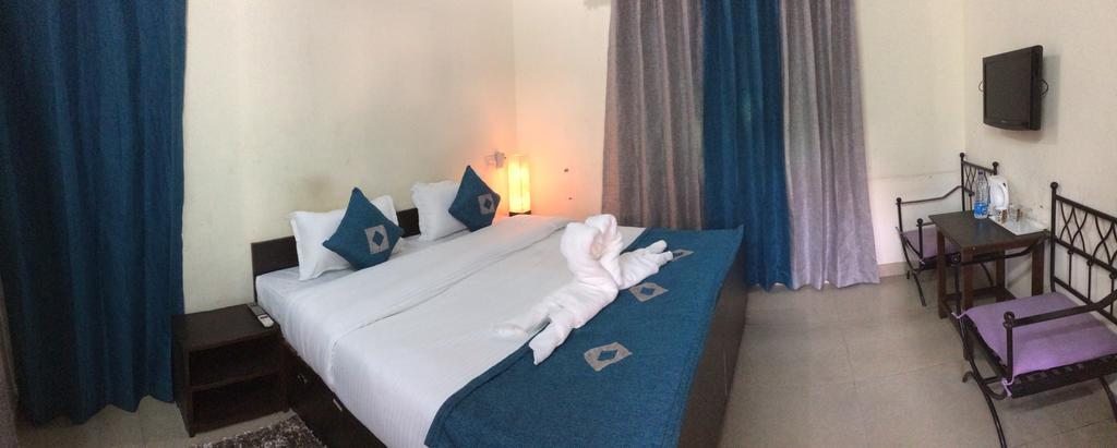 Hotel Sukhsadan Деградун Номер фото